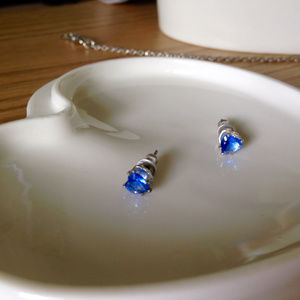 Heart-shaped blue studs with silver backing